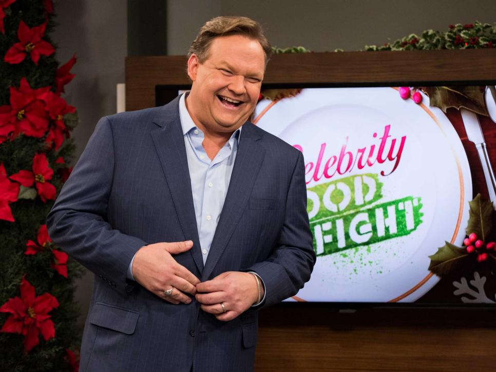 Andy Richter in front of Celebrity Food Fight logo