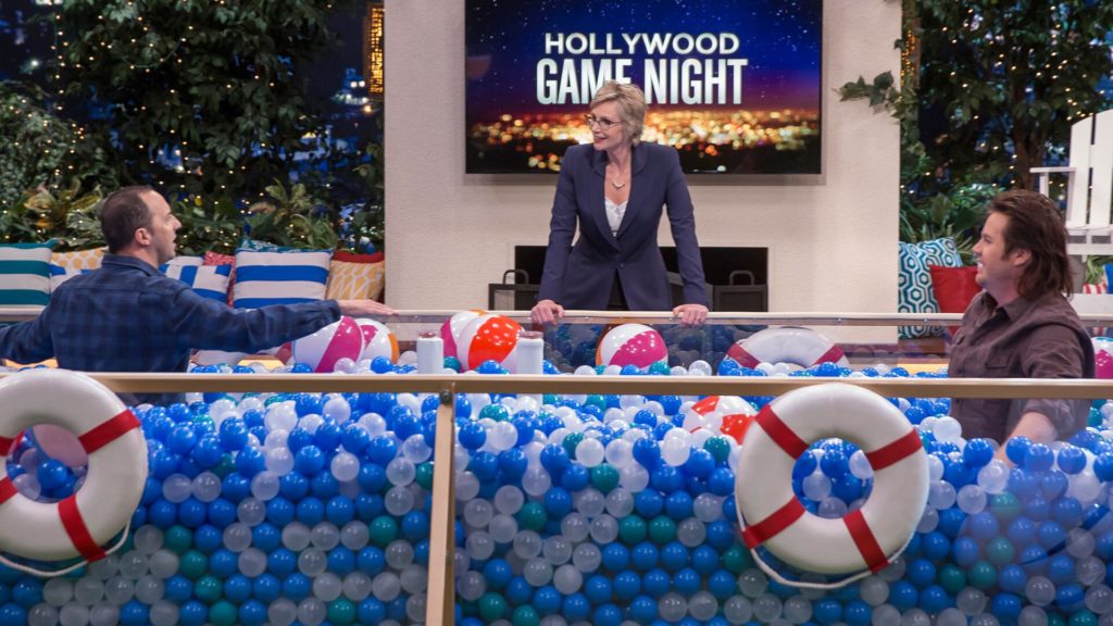 Jane Lynch with celebrities in the Smash the Buzzer ball pit
